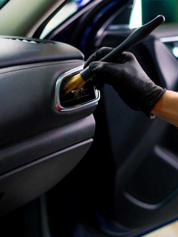 car-wash-worker-thoroughly-cleaning-the-interior-o-2024-12-02-17-08-36-utc-min